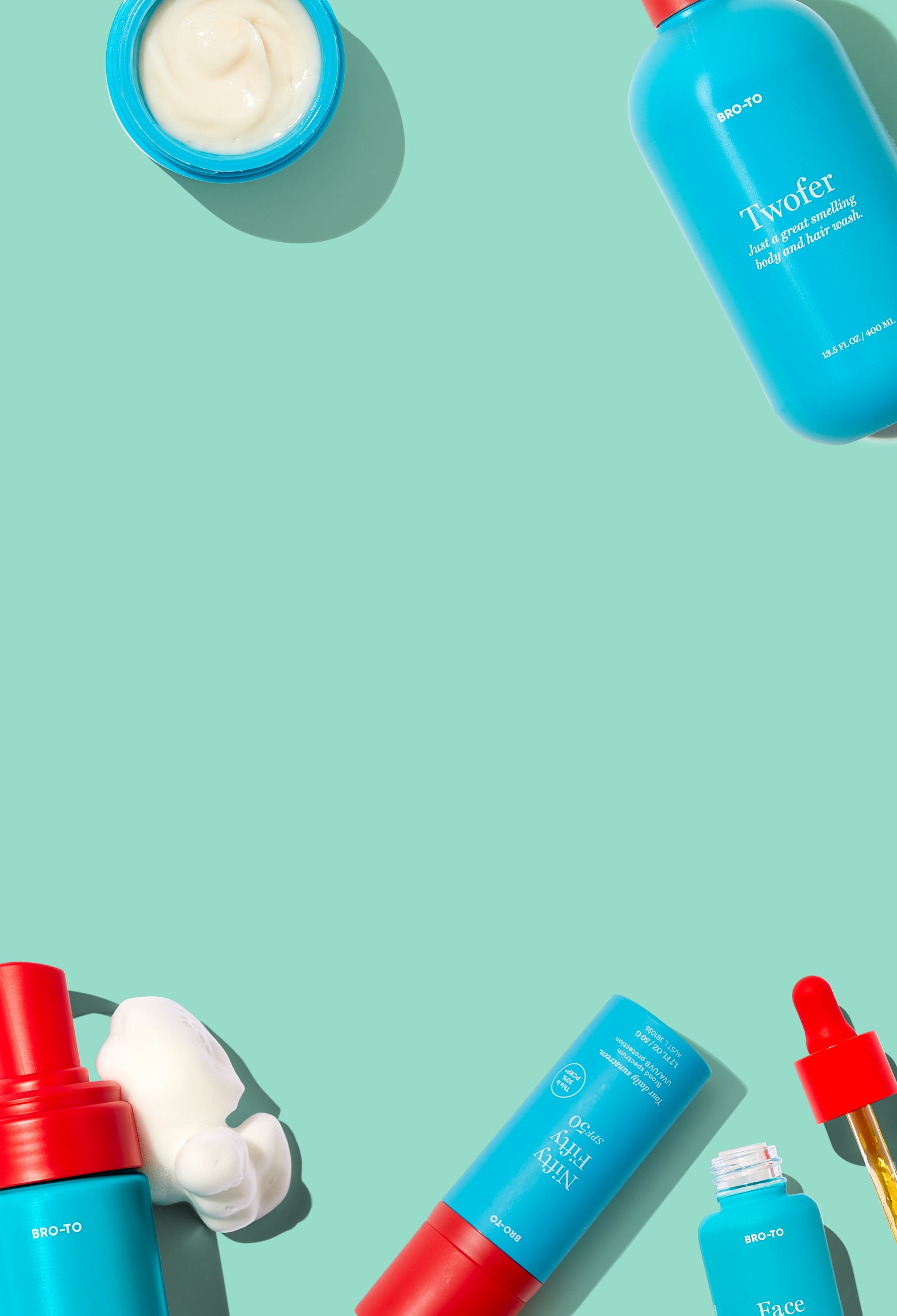 Skincare products, including bottles, a jar, and foam, arranged around the edges of a mint green background, leaving the center empty. Products are mostly blue with some red accents.