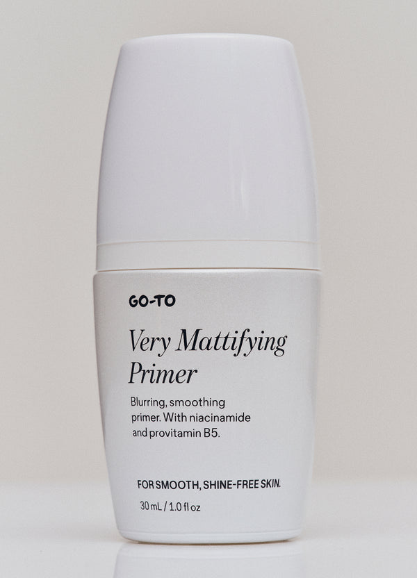 A white bottle of GO-TO Very Mattifying Primer with black text on the front, promising blurring, smoothing, and shine-free skin. The bottle contains 30 mL (1.0 fl oz) and stands against a plain background.