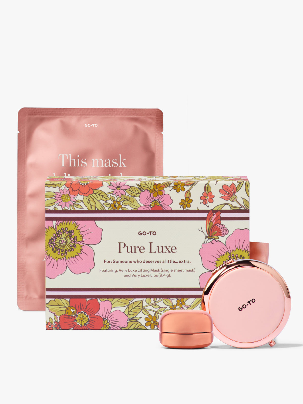 Pure Luxe skincare gift set from Go To Skincare with a floral box pink lifting sheet mask pouch peptide lip balm and round pink case on a white background