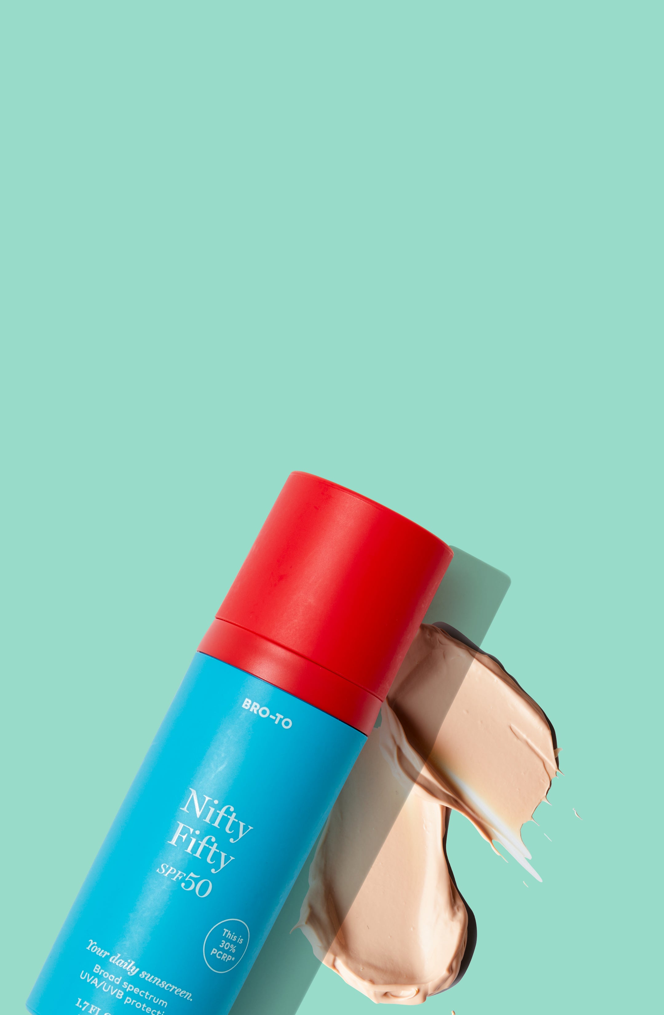 Nifty Fifty next to a swatch of sunscreen, against a mint green background.