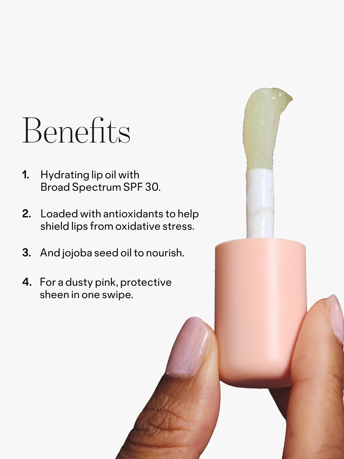 Benefits infographic showing a hand holding a peach pink lip oil with a doe foot applicator and text about SPF 30 antioxidants jojoba seed oil and dusty pink shine