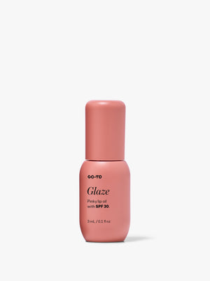 Pink Go-To Skincare Pinky Lip Glaze bottle with rounded cap and label showing lip oil with SPF 50 on a white background