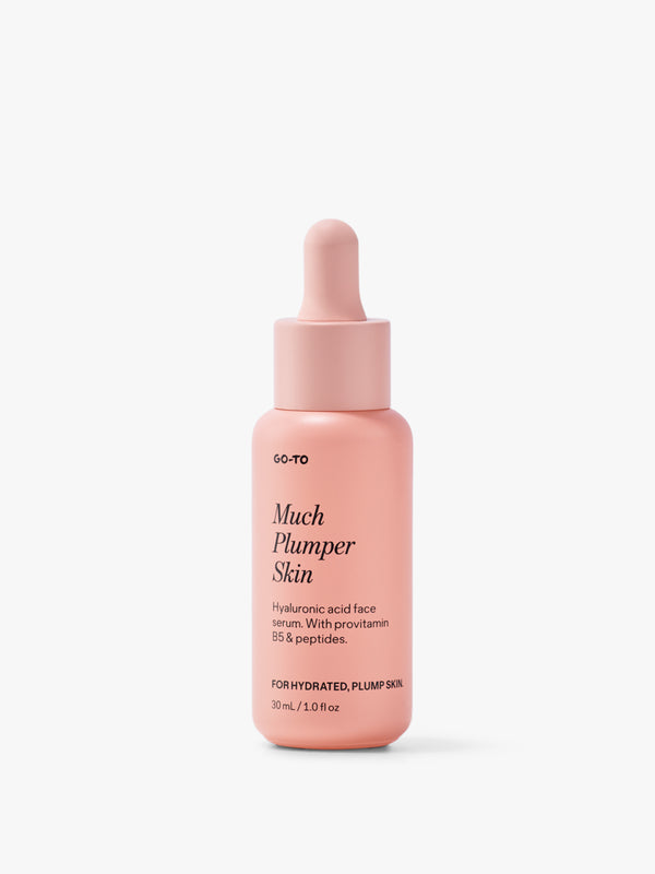 Pink bottle of Go-To Much Plumper Skin serum with hyaluronic acid, provitamin B5, and peptides for hydrated, plump skin.