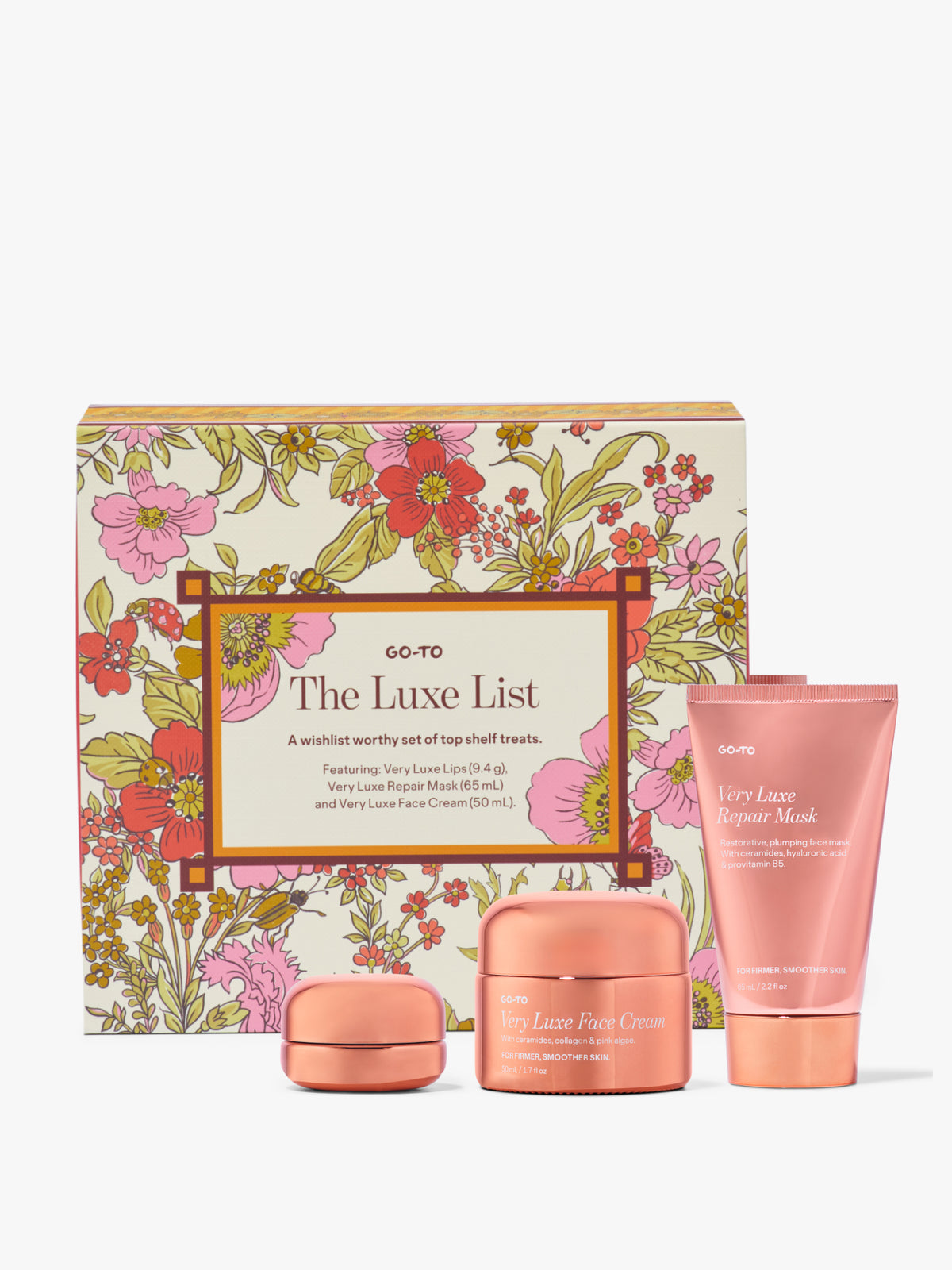 Go-To Skincare Luxe List gift set with floral box cream jar lip balm and repair mask in pink packaging against a white background